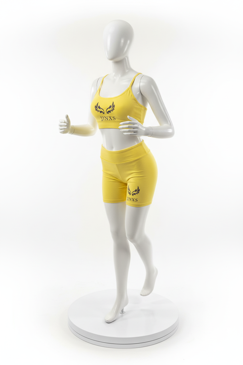 Rotating mannequin wearing yellow Jinxs athletic set
